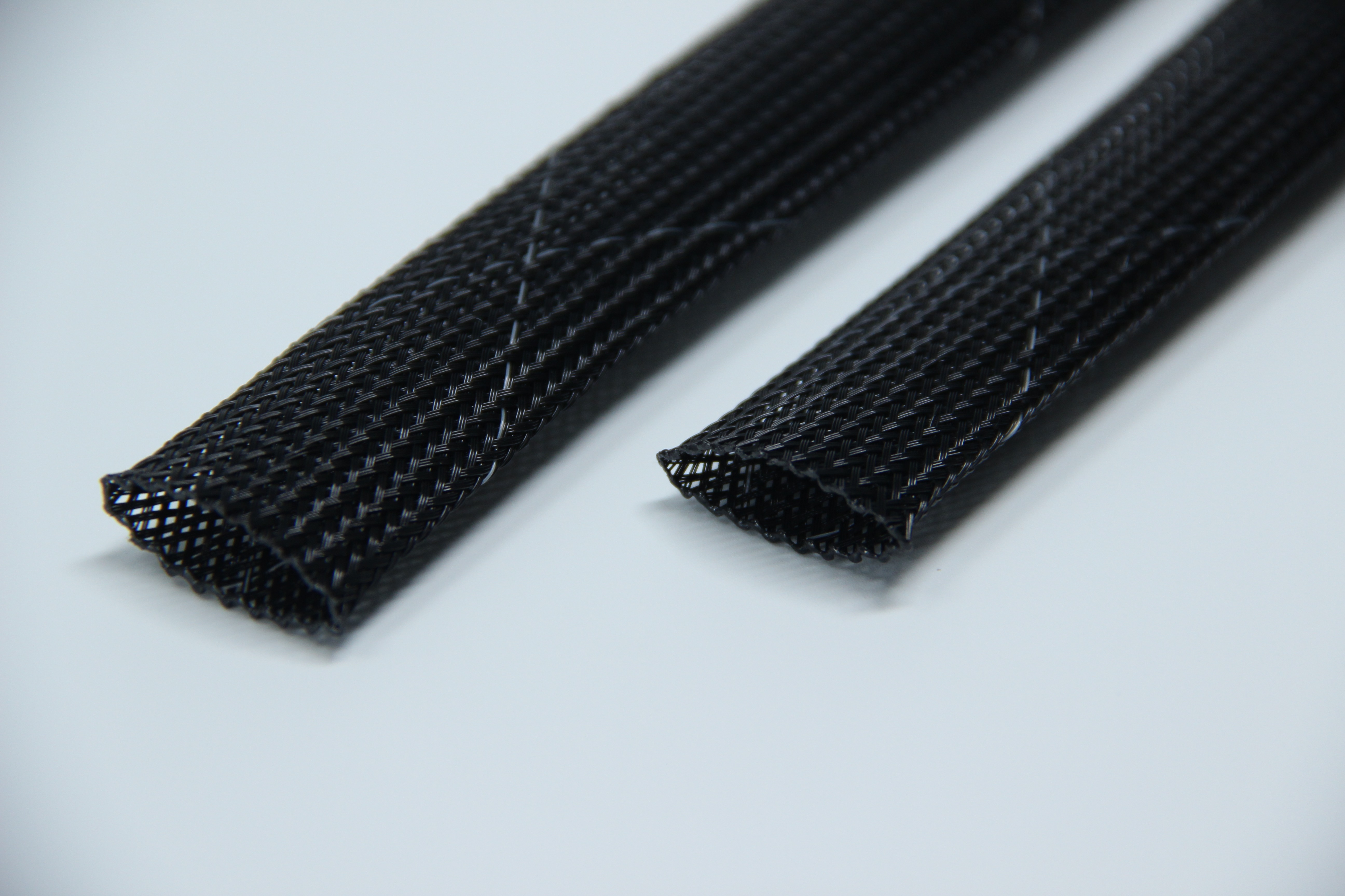 Black braided SPANDOFLEX sleeve cut ends